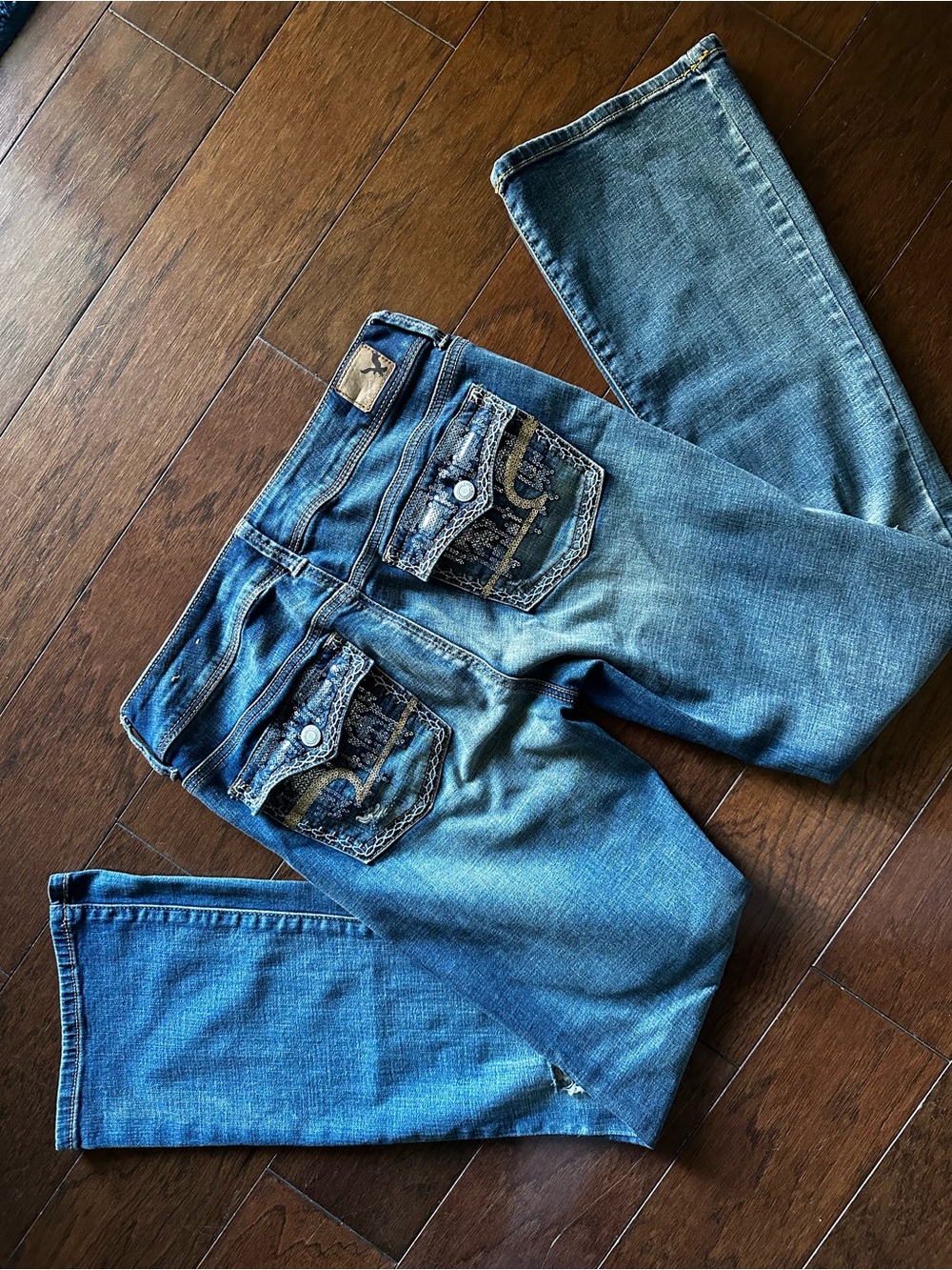 Women’s American Eagle Bootcut blue Jeans with sequin Back Pockets